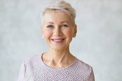 smiling silver-haired woman